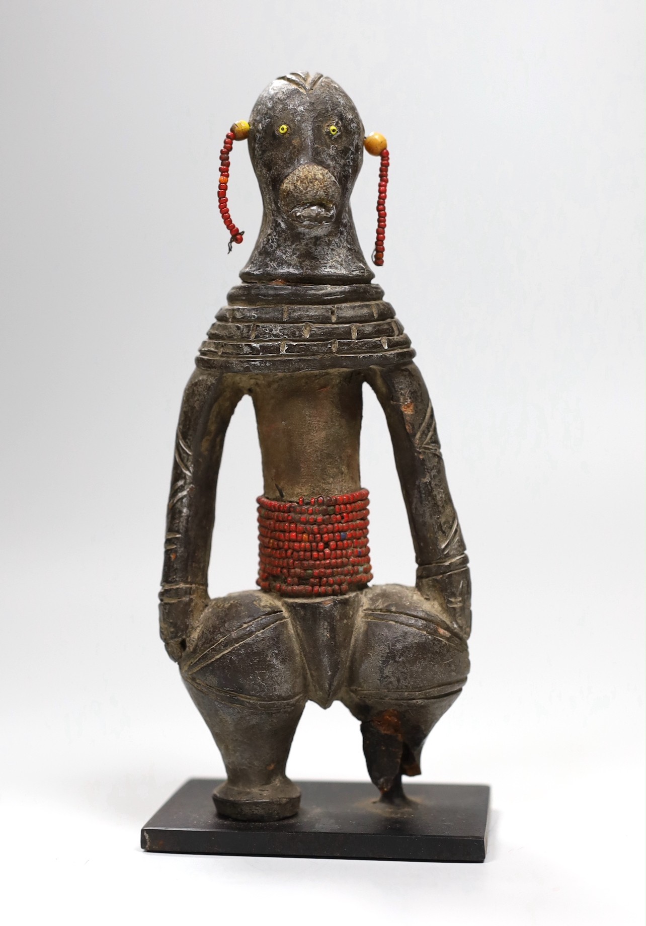 A Benin type cast iron figure. 20.5cm high